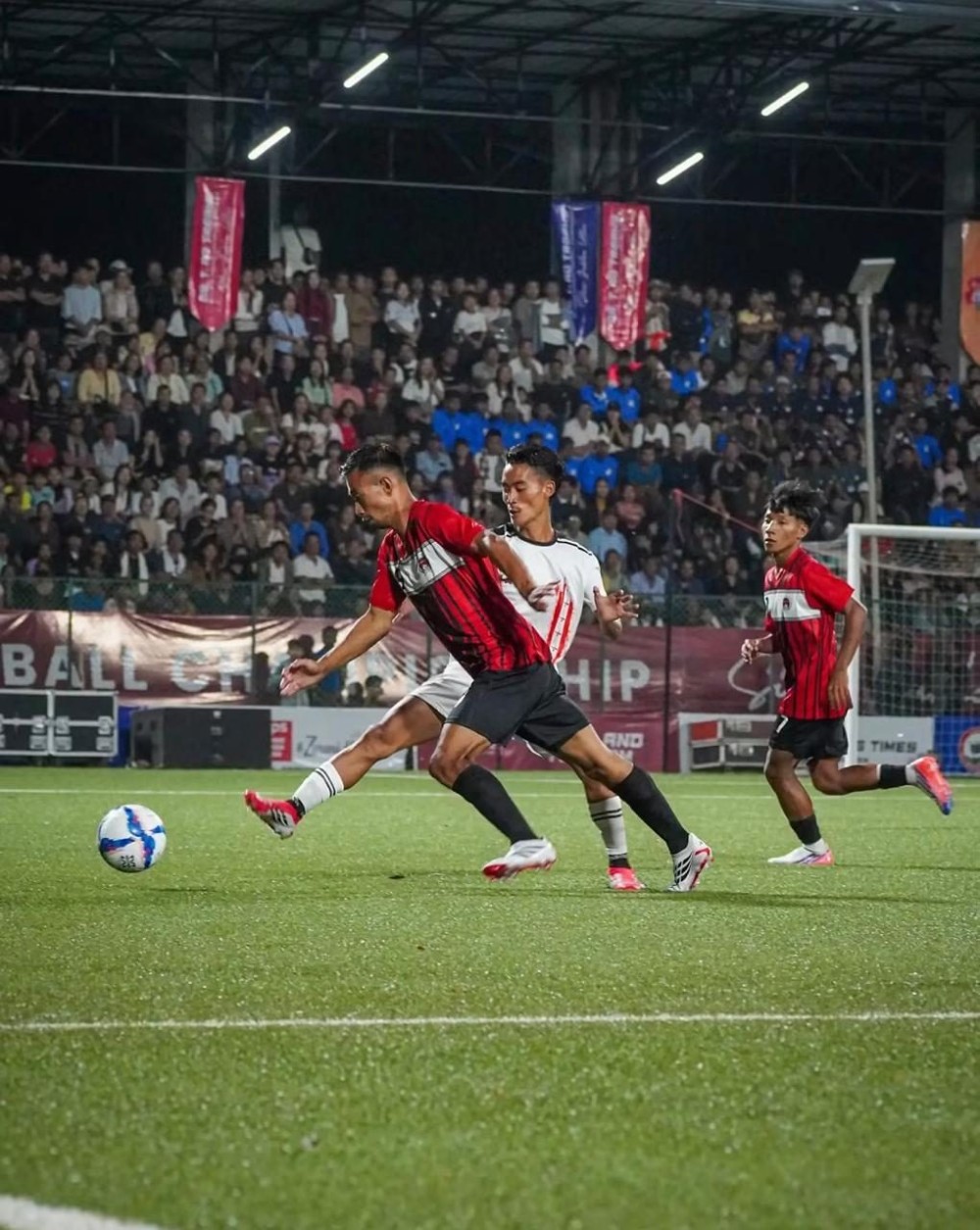 Mokokchung and Wokha player challenge for the ball during the opening match of the Dr T Ao Tropy 2026 in Mokokchung on October 13.